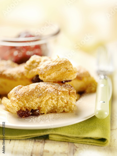 pastry with raisins and powder sugar served