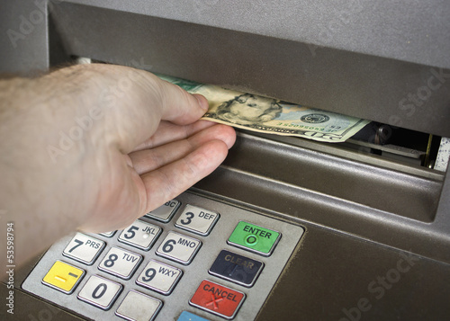 receiving money from the ATM.