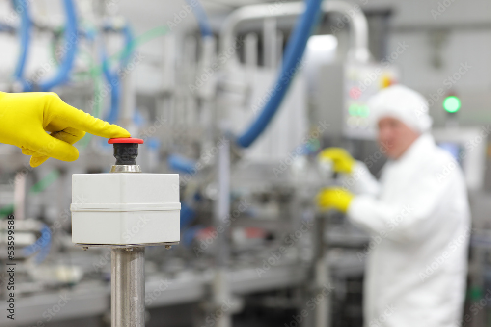 hand in glove pressing button - starting industrial process hand in glove pressing button - starting industrial process