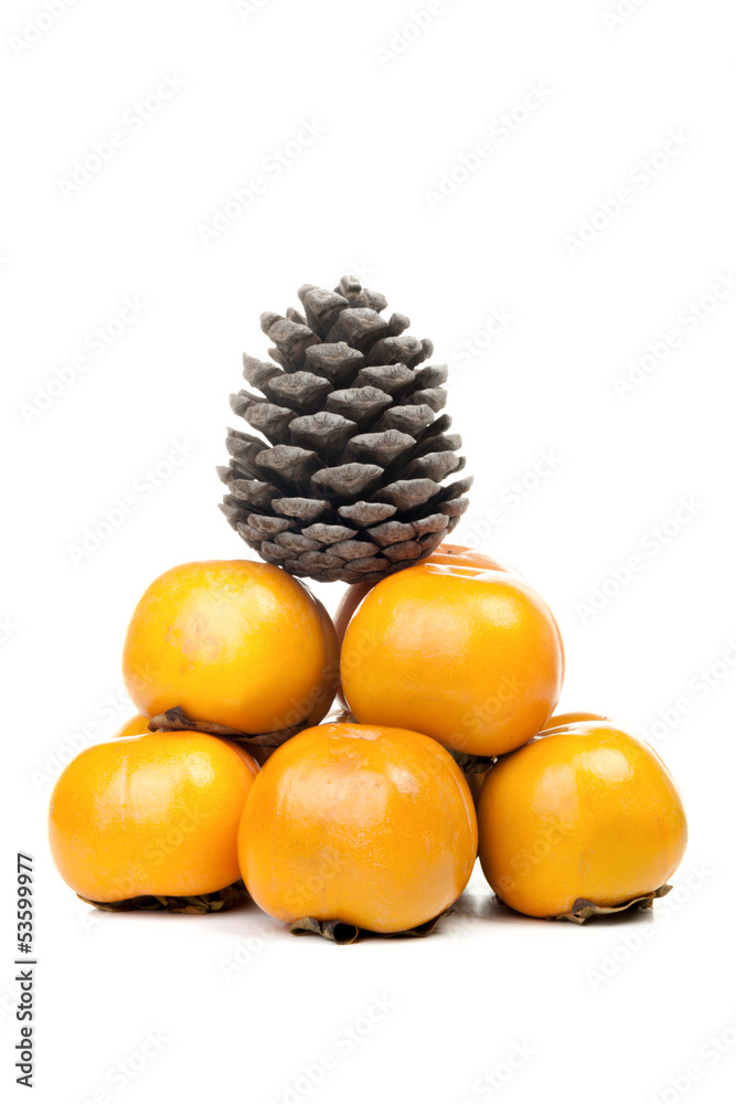 Cone on a persimmons in bright ripe pyramid Cone on a persimmons in bright ripe pyramid