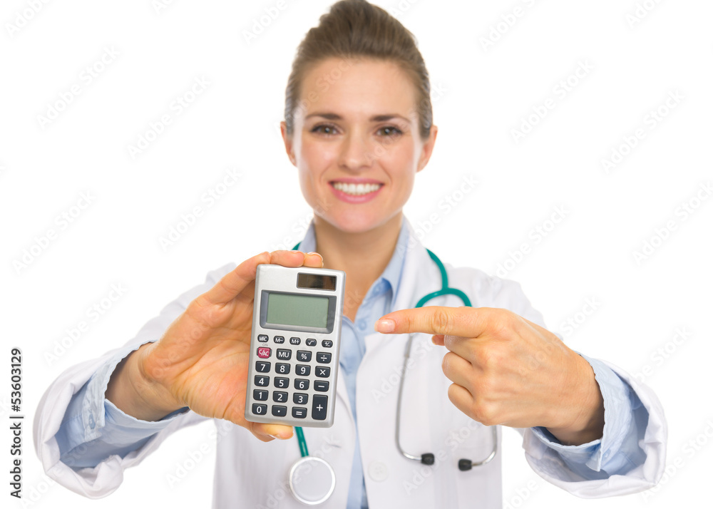 Closeup on doctor woman pointing on calculator Closeup on doctor woman pointing on calculator