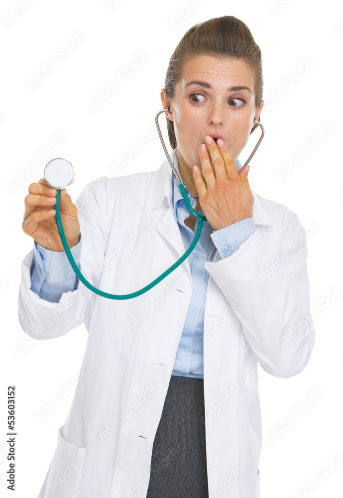Surprised doctor woman using stethoscope Surprised doctor woman using stethoscope