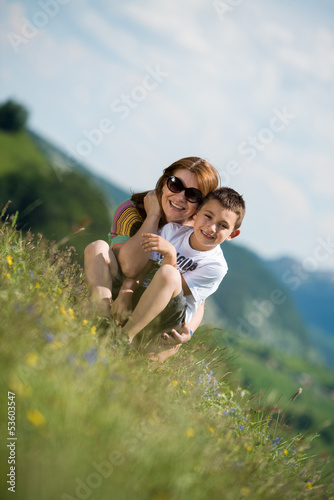 mother with son sitting and spreading love