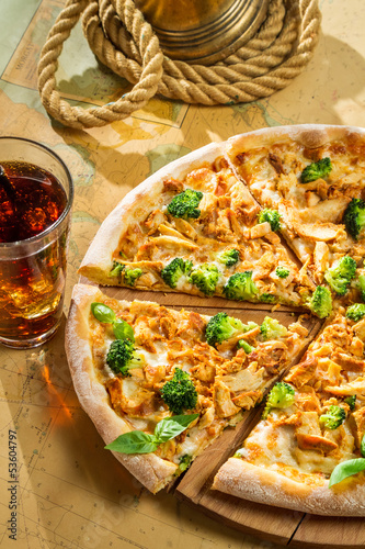 Fresh pizza with broccoli, chicken and cheese