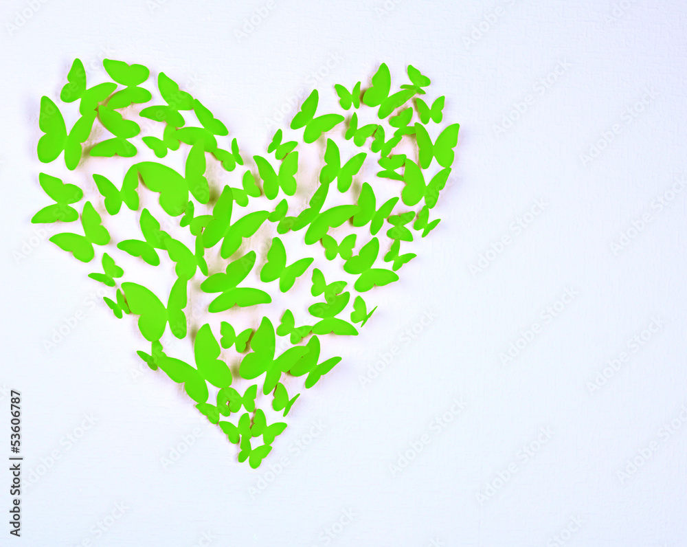 Paper butterflies in form of heart on wall Paper butterflies in form of heart on wall
