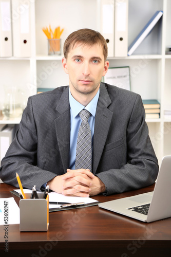 Young businessman in office...