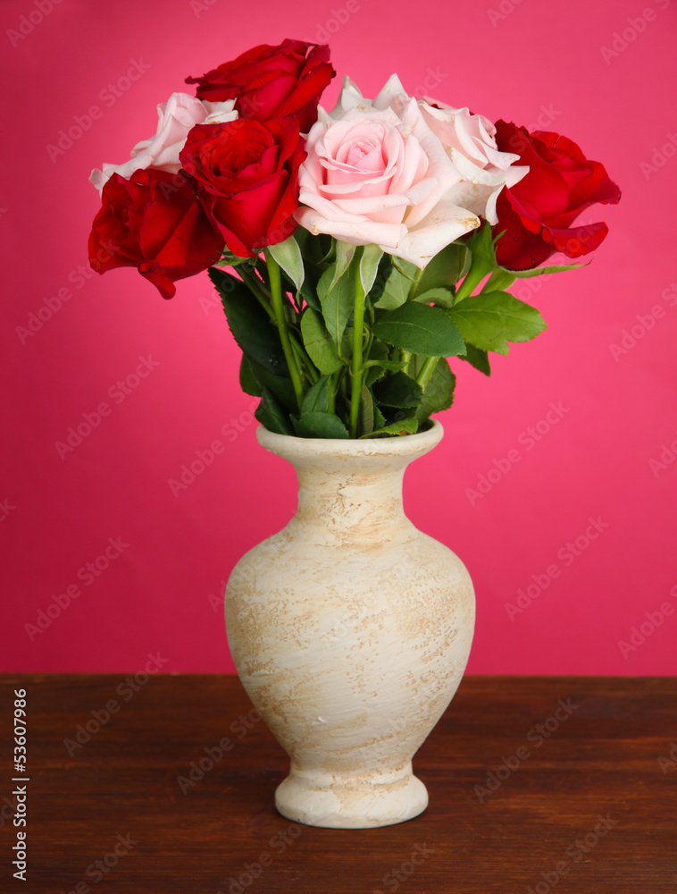 Beautiful bouquet of roses in vase with gift Beautiful bouquet of roses in vase with gift