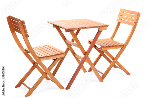 Wooden table with chairs isolated on white