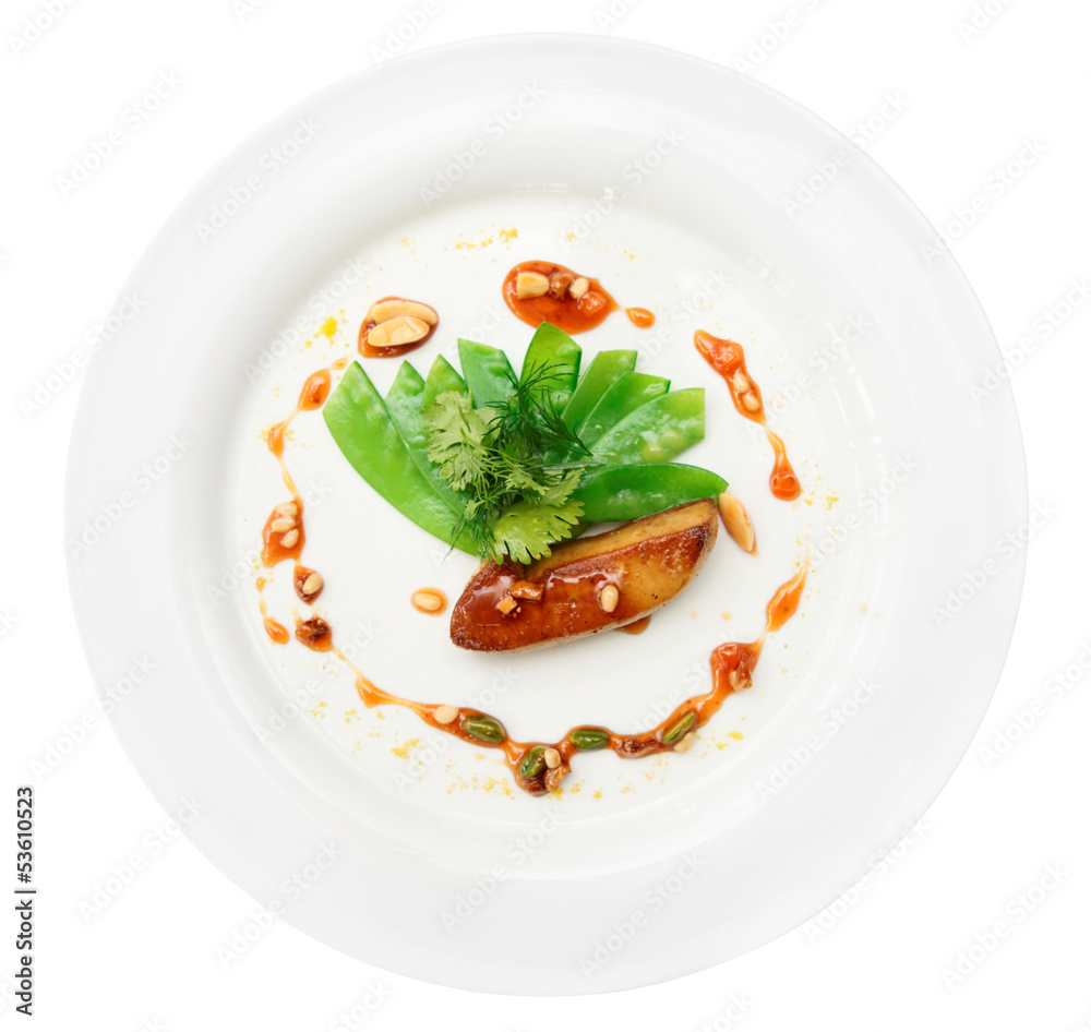 Fried foie gras with caramel and vegetables, isolated
