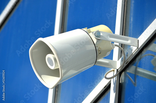 Speaker on a glass facade outdoors the building