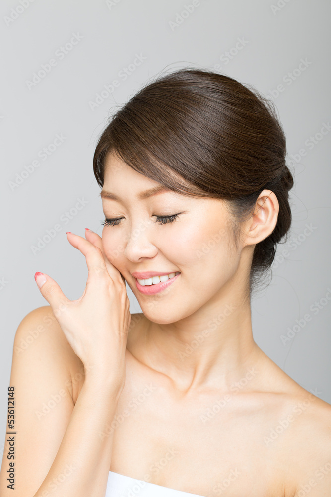 Beautiful asian woman isolated on gray background Beautiful asian woman isolated on gray background