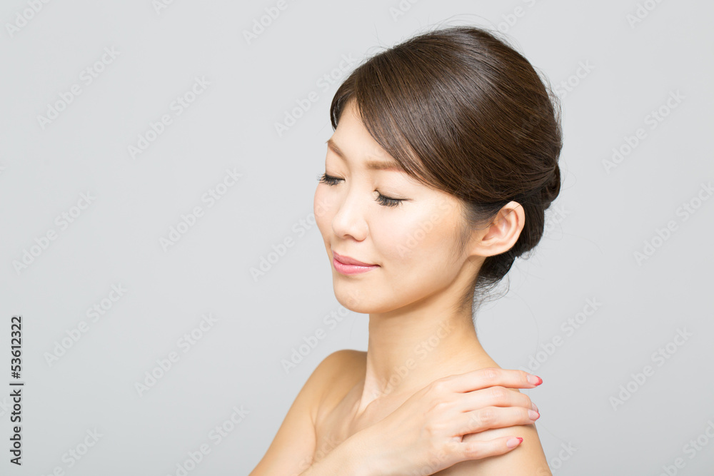 Beautiful asian woman isolated on gray background Beautiful asian woman isolated on gray background