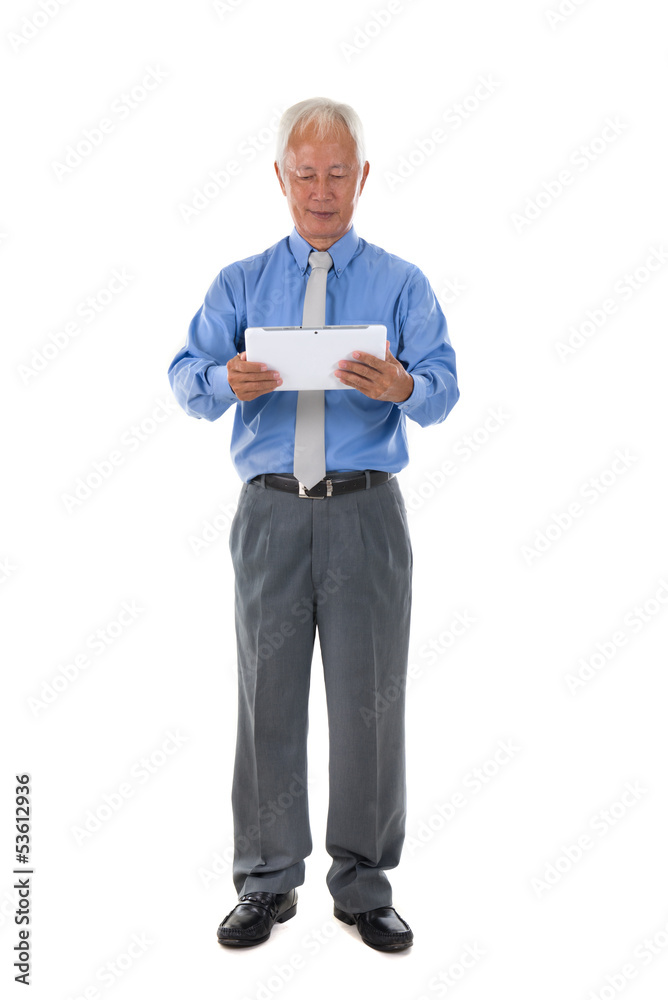 senior chinese singaporean with a tablet business man isolated o senior chinese singaporean with a tablet business man isolated o