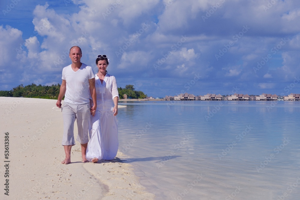 happy young couple at summer vacation have fun and relax at bea happy young couple at summer vacation have fun and relax at bea