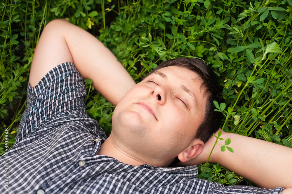 man sleeping on the grass man sleeping on the grass