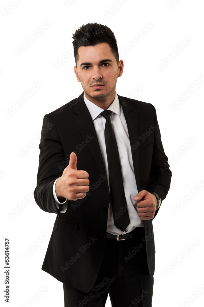 Handsome young businessman showing the thumbs up sign Handsome young businessman showing the thumbs up sign