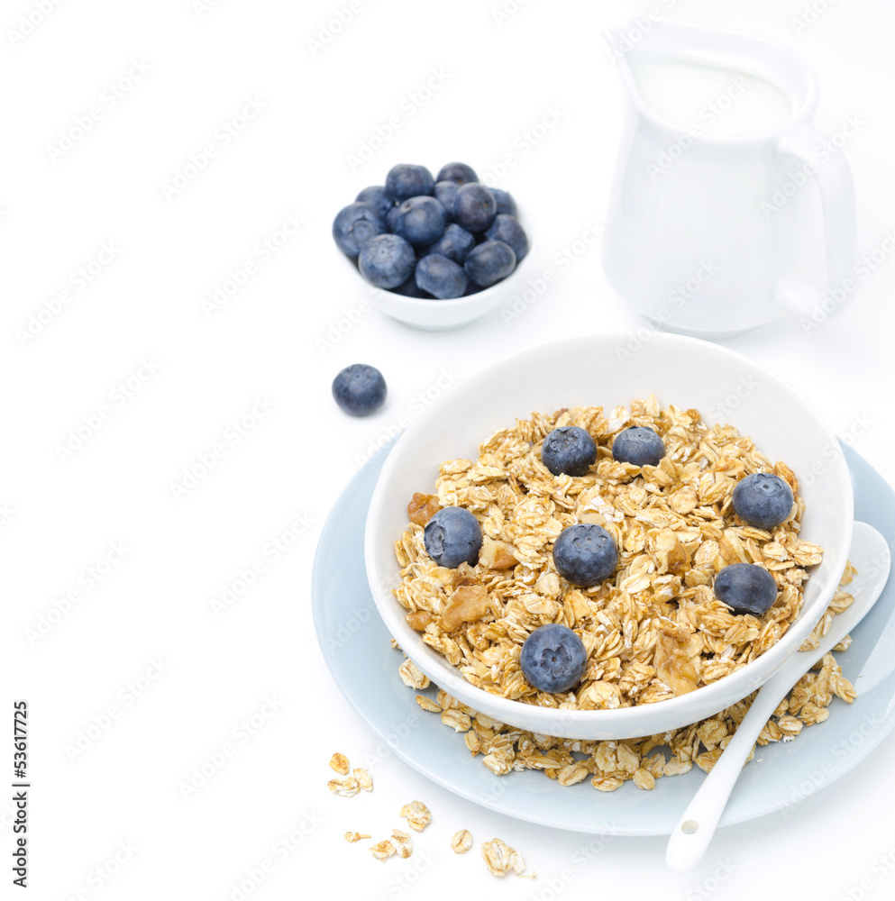 homemade granola, blueberries and jug of milk, isolated on white homemade granola, blueberries and jug of milk, isolated on white
