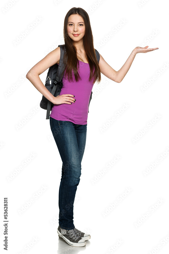 Casual girl wearing backpack showing copy space on palm Casual girl wearing backpack showing copy space on palm