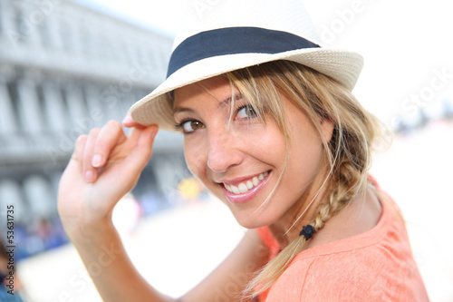 Portrait of beautiful blond girl with hat