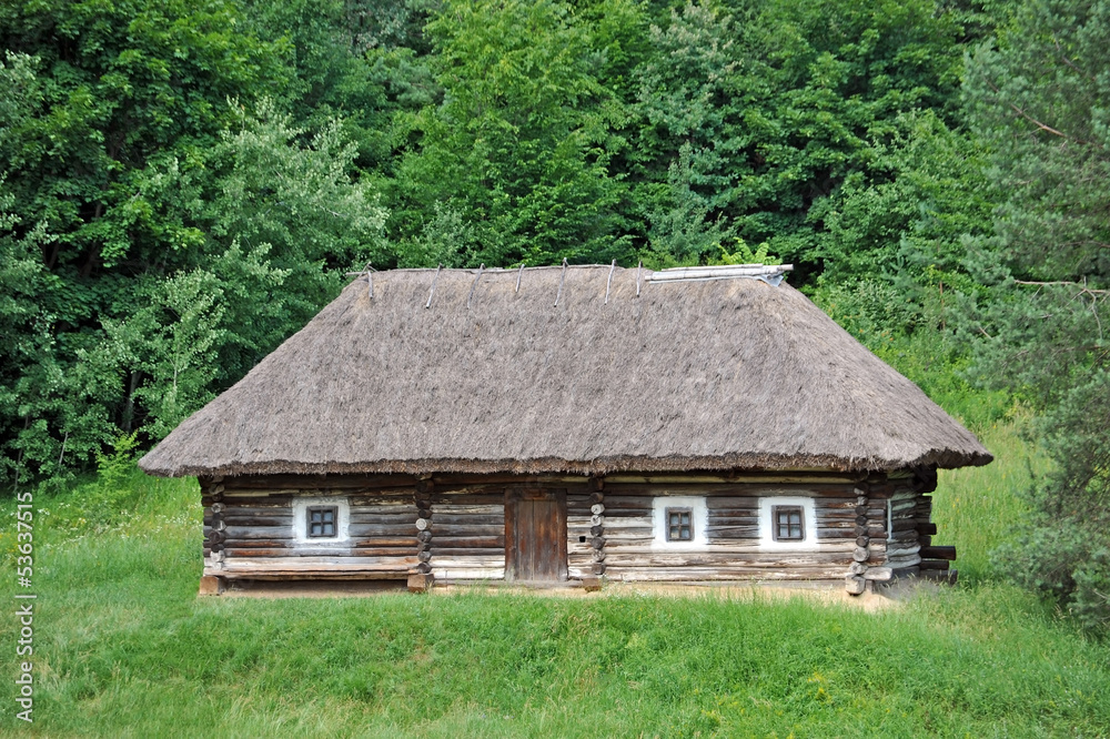 Ancient traditional ukrainian rural cottage with a straw roof