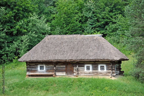 Ancient traditional ukrainian rural cottage with a straw roof