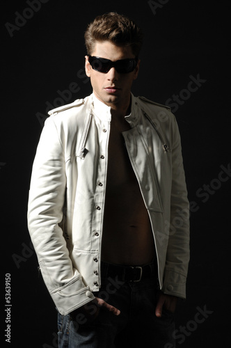 Young handsome man wearing dark sunglasses