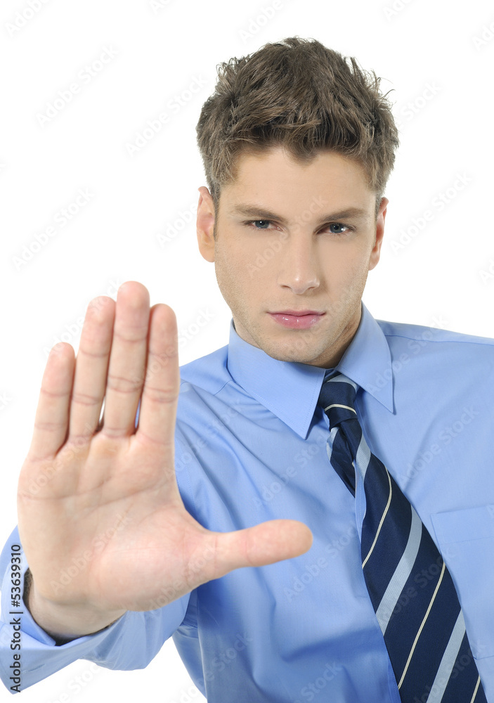 Young businessman doing a stop sign with his hand Young businessman doing a stop sign with his hand