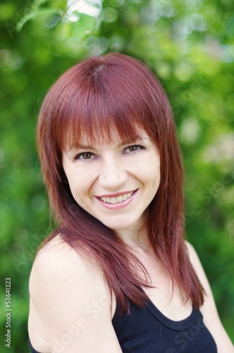 portrait of beautiful smiling woman outdoors