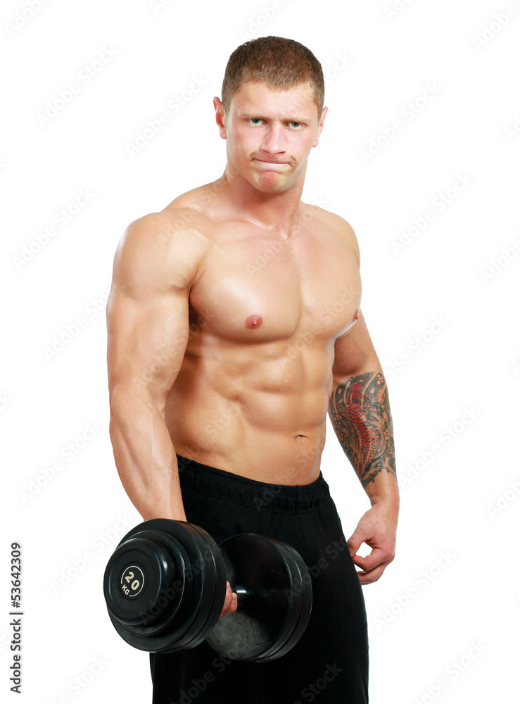 Handsome muscular man working out with dumbbells Handsome muscular man working out with dumbbells