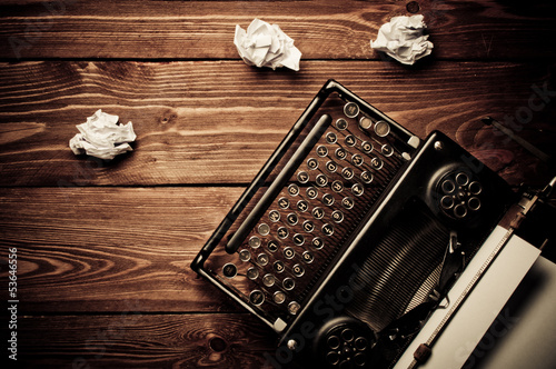 Vintage typewriter and a blank sheet of paper, retouching retro