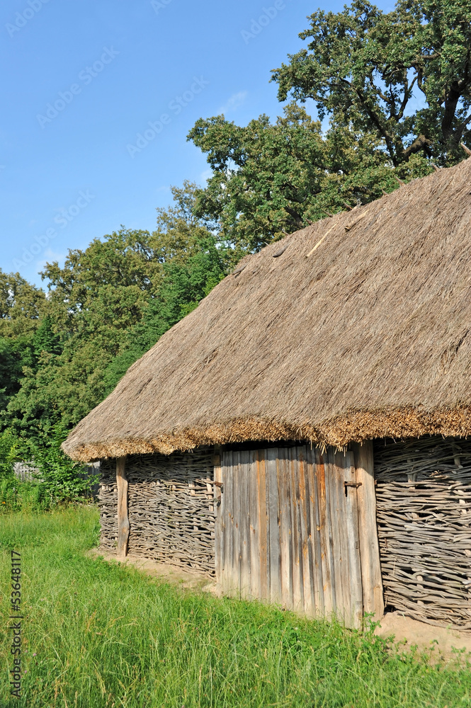 Ancient traditional ukrainian rural barn with a straw roof Ancient traditional ukrainian rural barn with a straw roof