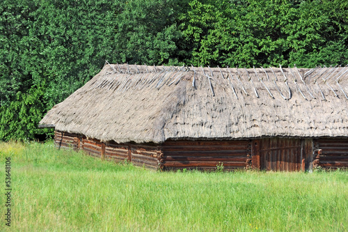 Ancient traditional ukrainian rural barn with a straw roof © Unkas Photo