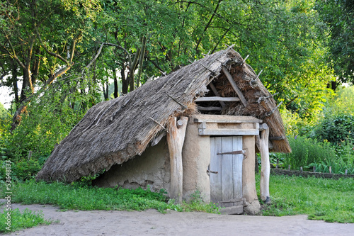 Ancient traditional ukrainian rural barn with a straw roof