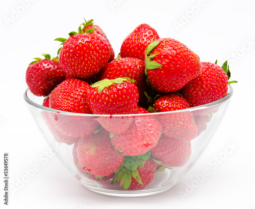 Red strawberry in the bowl isolated on white