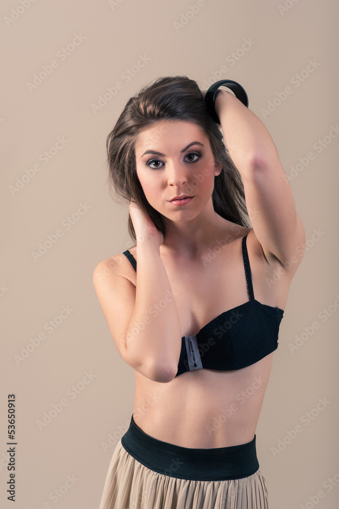 Sexy woman wearing lingerie against beige background. Sexy woman wearing lingerie against beige background.