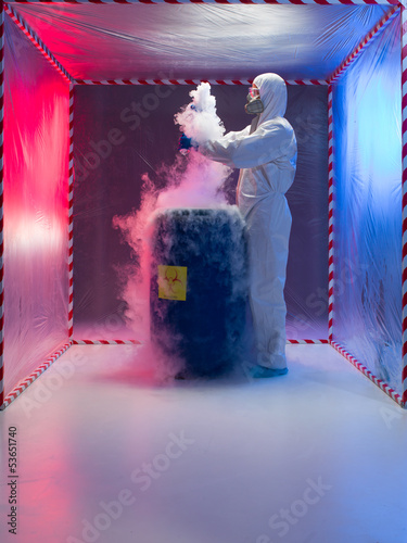 examining bio hazardous waste in containment tent