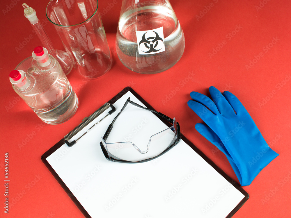 laboratory accessories with blank clipboard and goggles laboratory accessories with blank clipboard and goggles