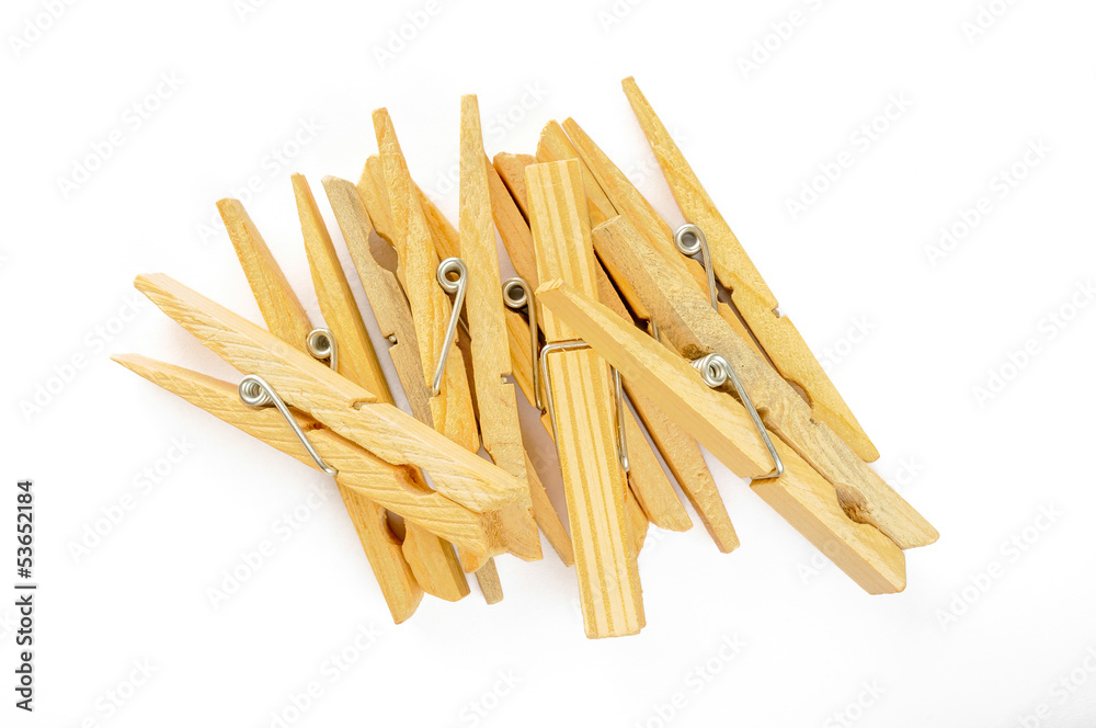 A little heap of wooden clothespin isolated on white background