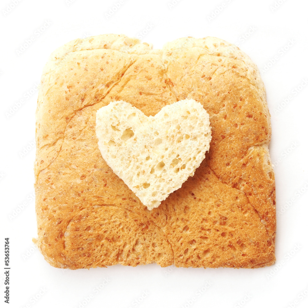 Sliced whole wheat bread with heart shape on white background Sliced whole wheat bread with heart shape on white background