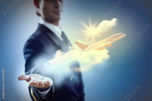 Image of pilot with plane in hand