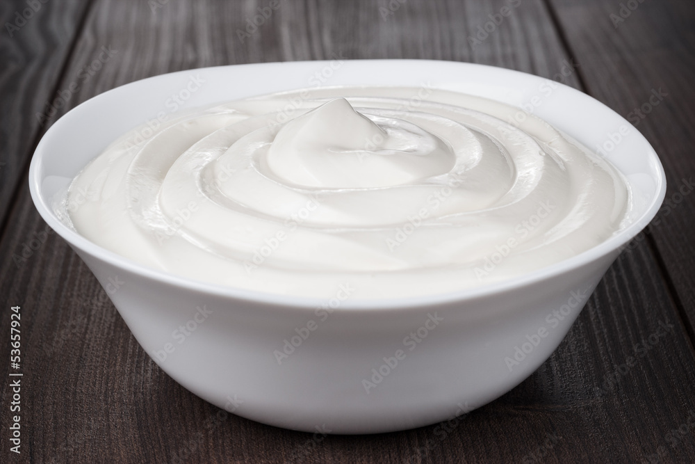white bowl full of sour cream white bowl full of sour cream