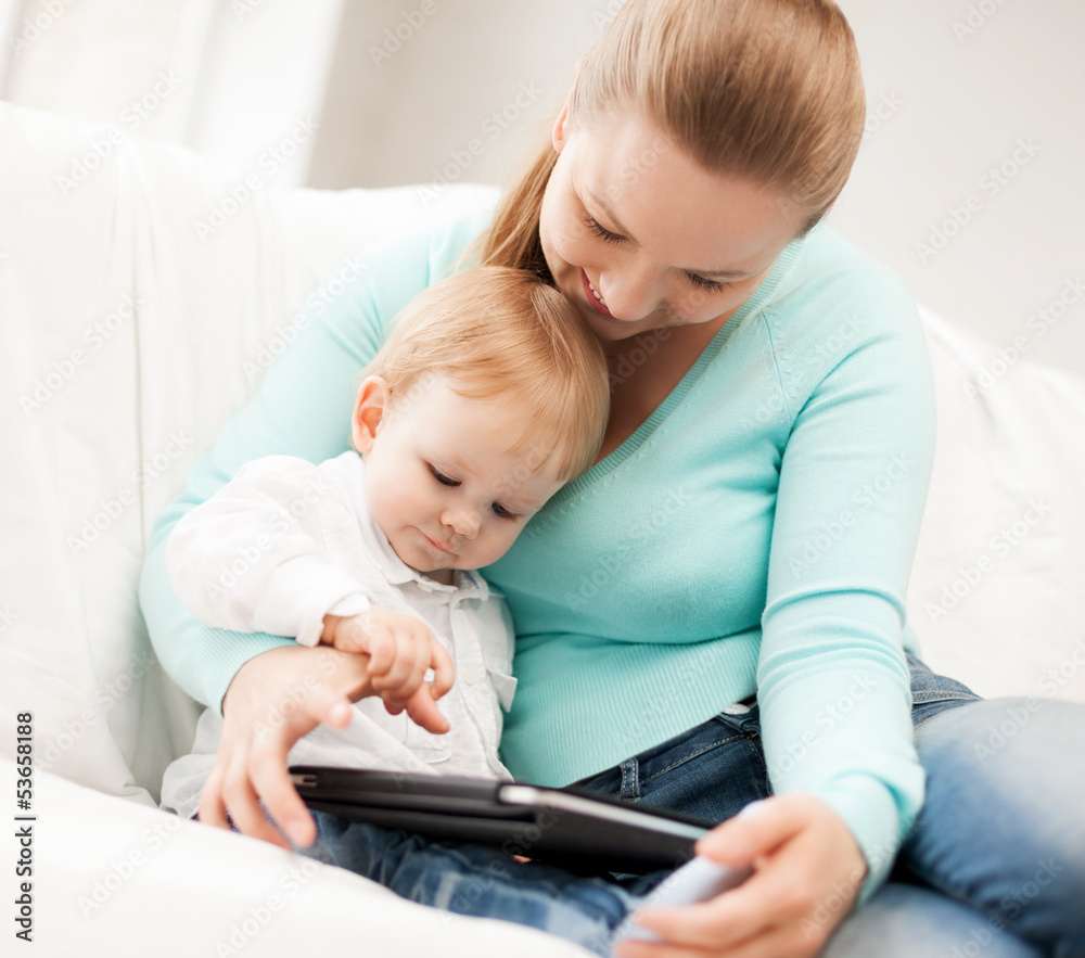 mother and adorable baby with tablet pc mother and adorable baby with tablet pc