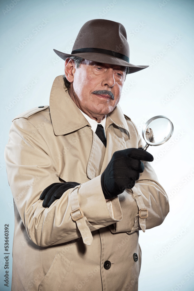 Retro detective man with mustache and hat. Holding magnifying gl Retro detective man with mustache and hat. Holding magnifying gl