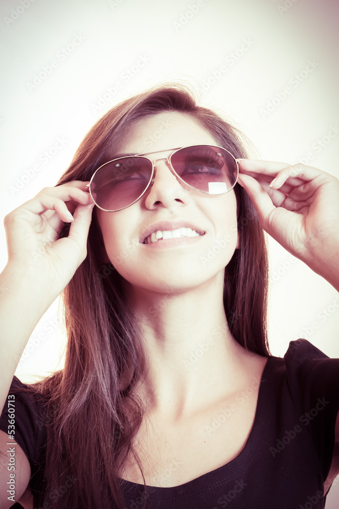 Attractive young woman posing in sunglasses Attractive young woman posing in sunglasses