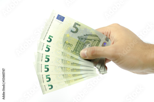 Hand offering five euro banknotes isolated on white