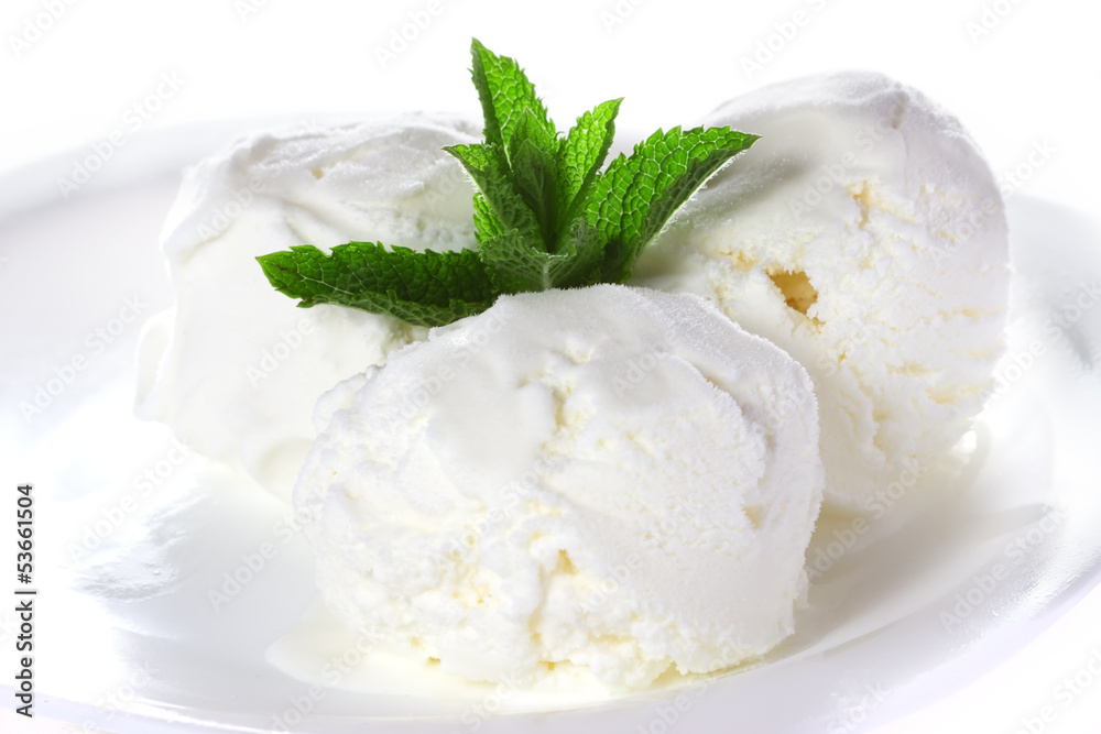 Vanilla ice cream with mint on a platter Vanilla ice cream with mint on a platter