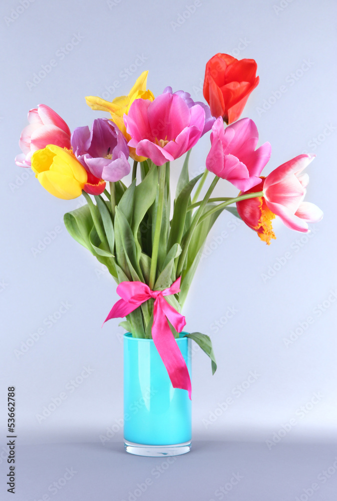 Beautiful tulips in bouquet on gray background Beautiful tulips in bouquet on gray background