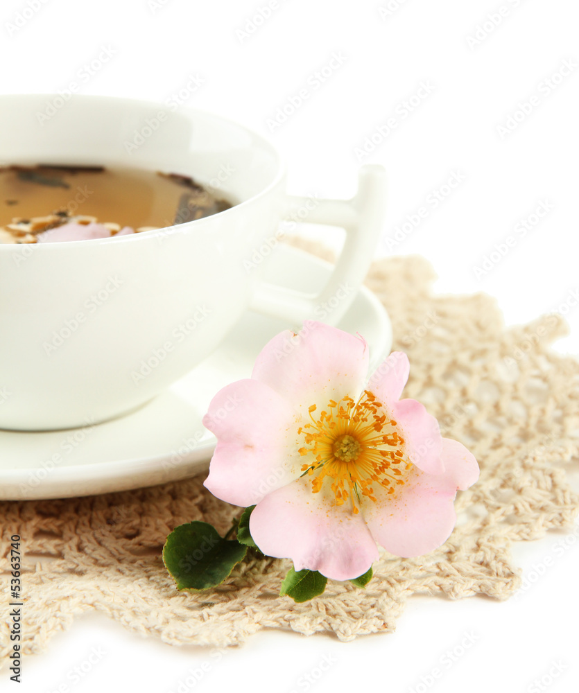Cup of herbal tea with hip rose flowers, isolated on white Cup of herbal tea with hip rose flowers, isolated on white