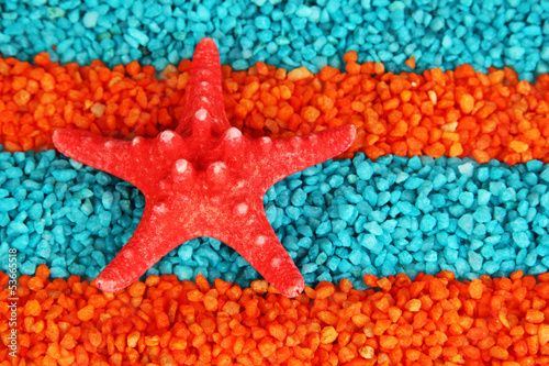 Starfish on colorful crystals of sea salt background