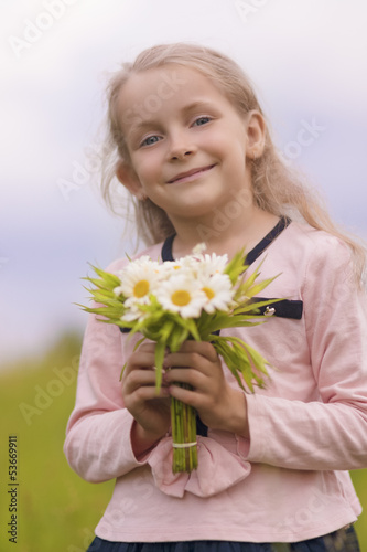 cute natural portrait of young little girl smiling